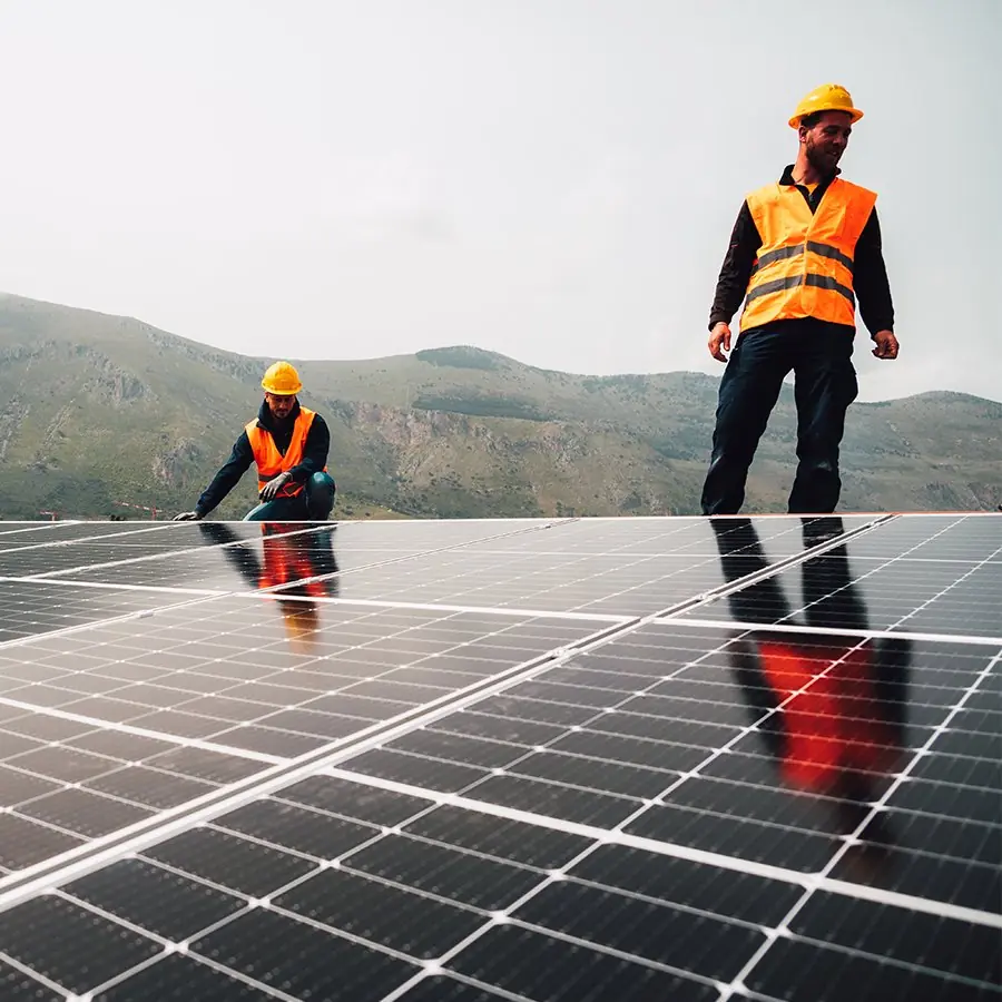 Installation team fitting solar panels